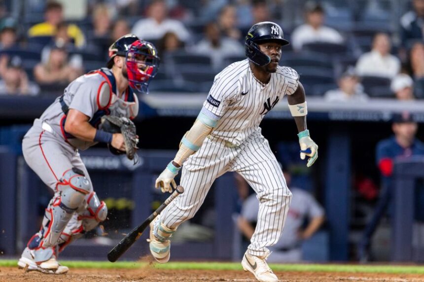 New York Yankees' Jazz Chisholm Jr., right, watches after he hit into a fielder's choice in the eighth inning during the second baseball game of a doubleheader against the Boston Red Sox, Saturday, Aug. 29, 2026, in New York. (AP Photo/Corey Sipkin)