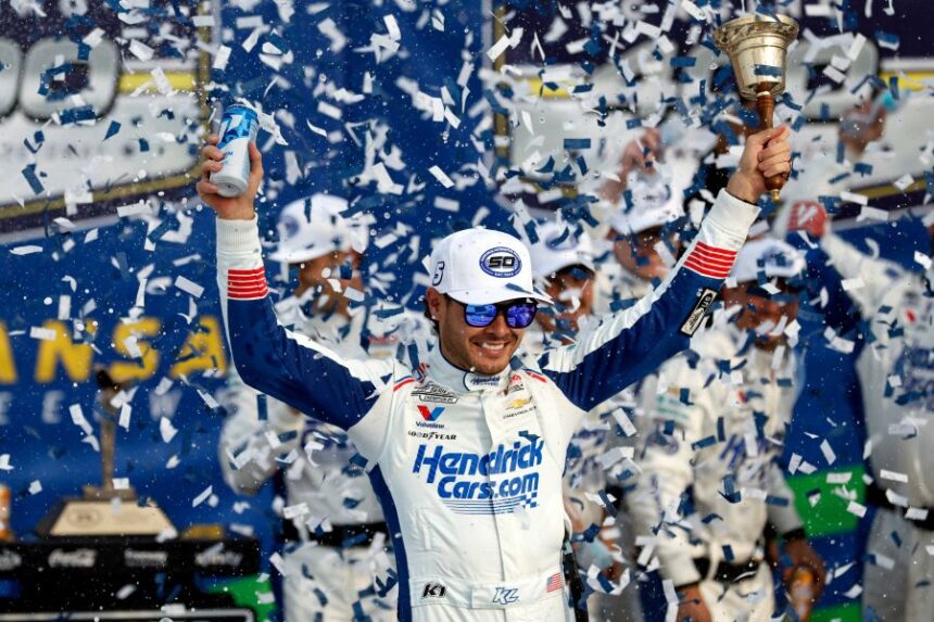 Kyle Larson celebrates in Victory Lane after winning a NASCAR Cup Series auto race in Kansas City, Kan., Sunday, Sept. 27, 2026. (AP Photo/Colin E. Braley)