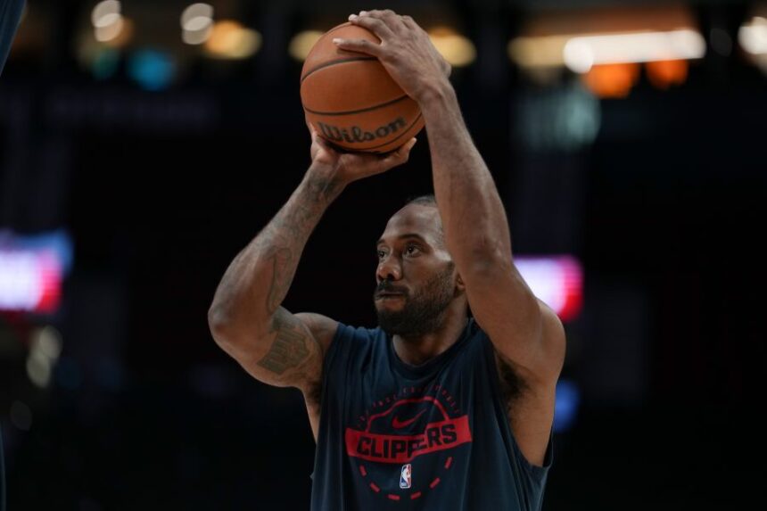 FILE - Los Angeles Clippers forward Kawhi Leonard warms up before an NBA basketball game April 10, 2026, in Portland, Ore. (AP Photo/Jenny Kane, File)