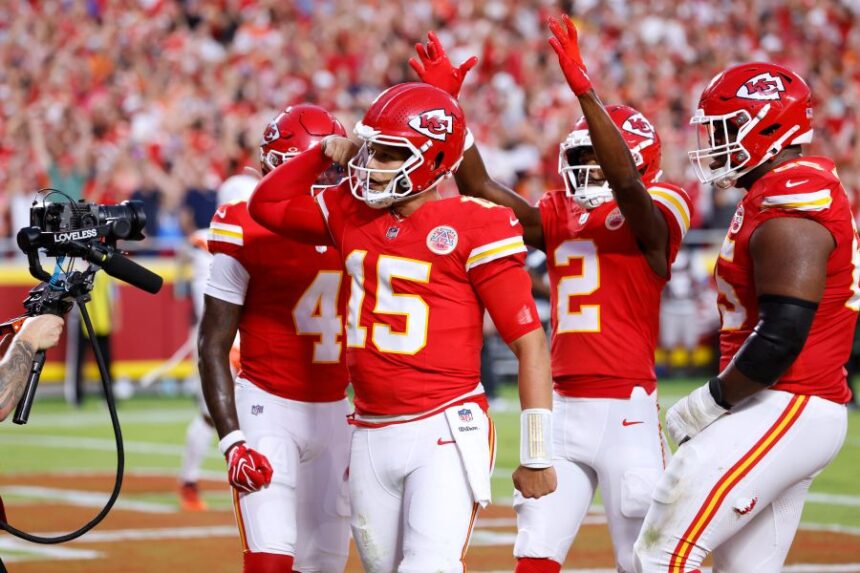 Kansas City Chiefs quarterback Patrick Mahomes (15) celebrates his touchdown run with teammates wide receiver Rashee Rice (4), wide receiver Tyquan Thornton (2) and guard Trey Smith (65) during the first half of an NFL football game against the Denver Broncos, Monday, Sept. 14, 2026, in Kansas City, Mo. (AP Photo/Colin E. Braley)