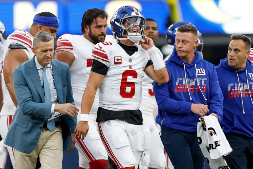 New York Giants quarterback Jaxson Dart (6) walks off the field with an injury during the first half of an NFL football game against the Los Angeles Rams in Inglewood, Calif., Monday, Sept. 21, 2026. (AP Photo/Caroline Brehman)