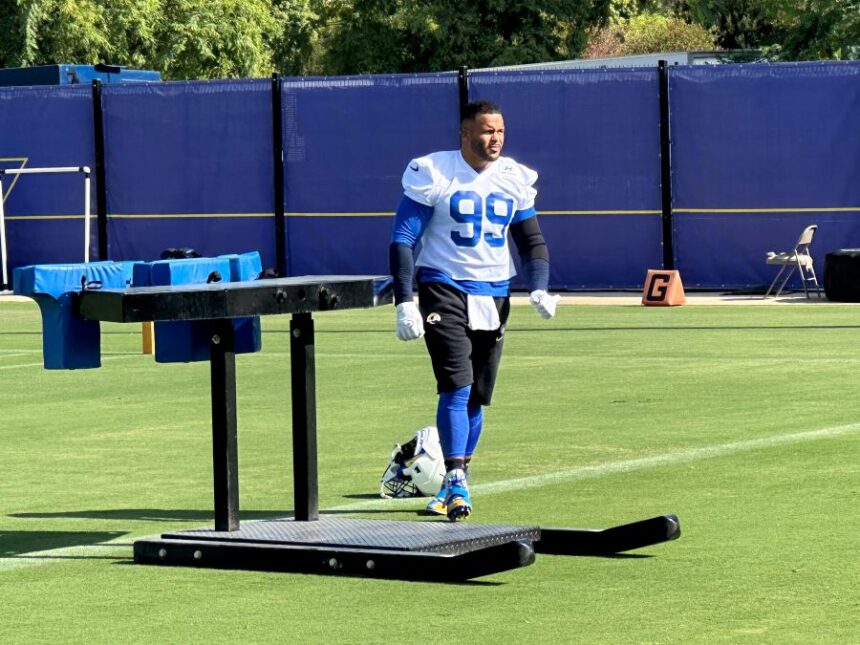 Aaron Donald takes the field for practice at the Los Angeles Rams' training complex in Los Angeles, Sunday, Aug. 30, 2026. (AP Photo/Greg Beacham)