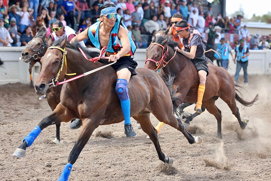 Eastern Idaho State Fair Indian Relays, JonMarc Skunkcap of Team White Knife out of Fort Hall