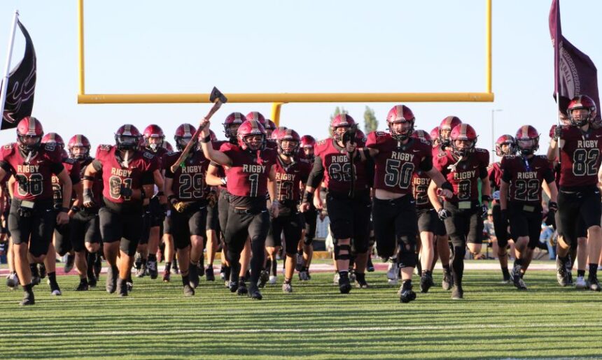 Rigby players charge onto the field for Friday's game with Syracuse (UT). | Allan Steele, EastIdahoSports.com.