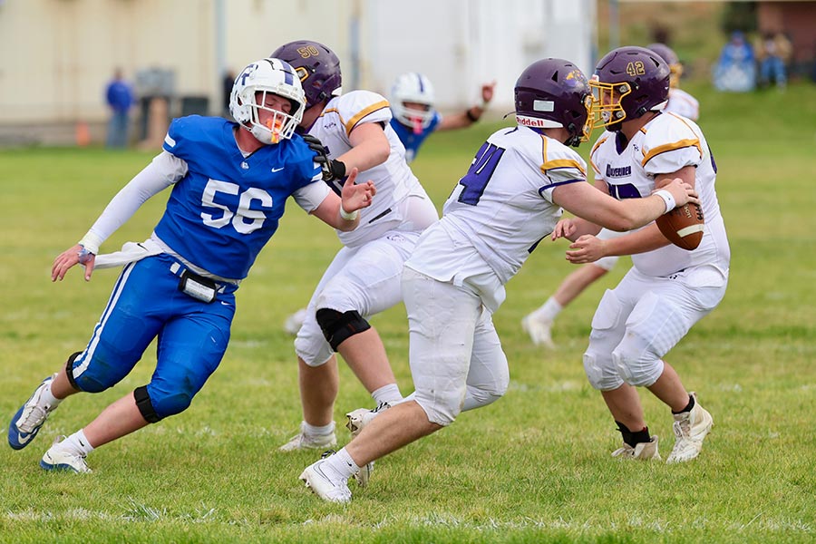 Rockland Jack Woodworth pressures the Garden Valley quarterback