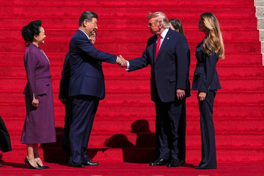 President Donald Trump, center right, shakes the hand of China's President Xi Jinping as first lady Melania Trump, right, and China's first lady Peng Liyuan, left, watch as they arrive at the National Archives Museum, Friday, Sept. 25, 2026, in Washington. (AP Photo/Julia Demaree Nikhinson)