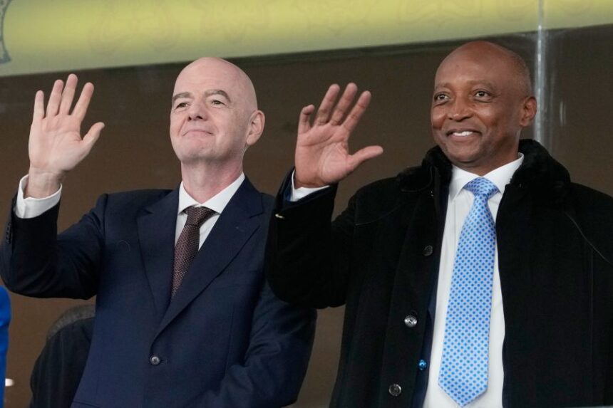 FILE - CAF President Patrice Motsepe and FIFA President Gianni Infantino wave from the tribune during the Africa Cup of Nations round of 16 soccer match between South Africa and Cameroon in Rabat, Morocco, Sunday, Jan. 4, 2026. (AP Photo/Themba Hadebe, File)