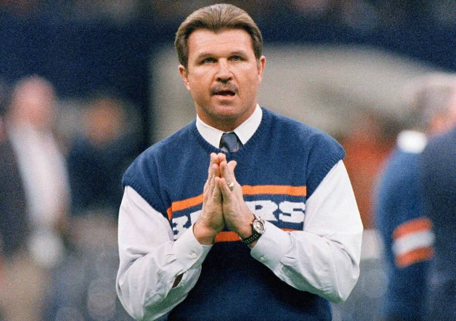 FILE - Chicago Bears head coach Mike Ditka strikes a prayerful pose as he watches the team workout, Jan. 26, 1986 in New Orleans before the start of NFL football's Super Bowl XX.