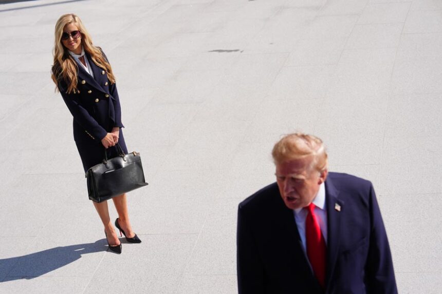 President Donald Trump speaks to the reporters as he walks to board Marine One on the South Lawn of the White House, Tuesday, Oct. 13, 2026, in Washington, as White House press secretary Katie Zacharia looks on. | Julia Demaree Nikhinson, Associated Press