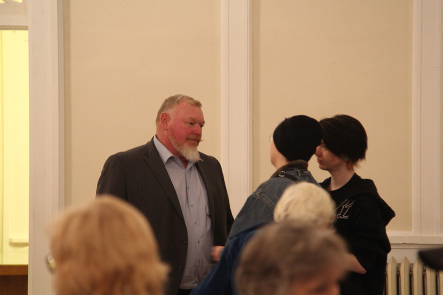 Roberts talks to Pence after the town hall.
