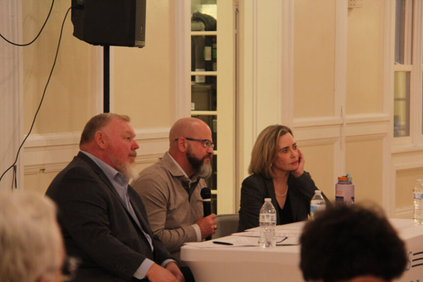 (From left to right) Former Rep. Nate Roberts, Sen. James Ruchti and Mary Shea listen to an attendee's question during a town hall.