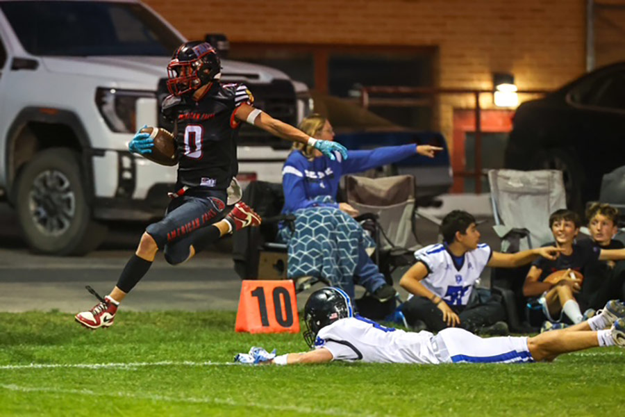 American Falls Hunter Grigg hurdles his way to the end zone