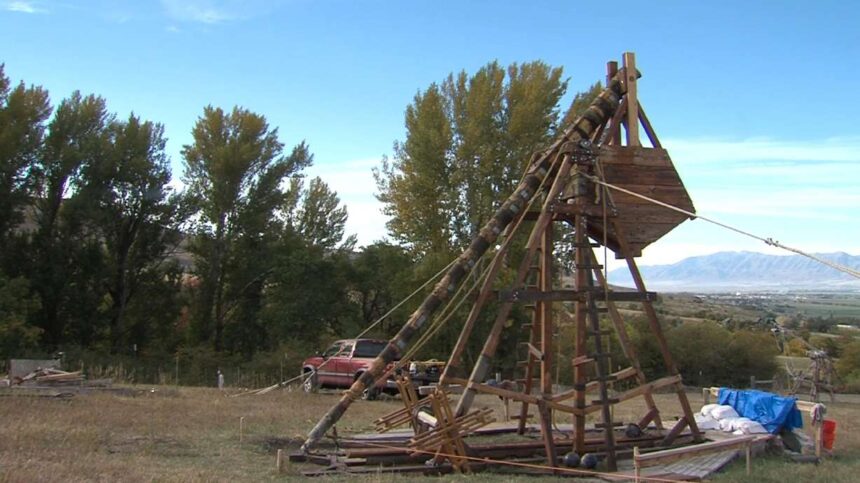 A former Utah State University student and a group of history buffs gathered at a Cache Valley farm on Saturday to launch a homemade trebuchet built using medieval techniques. | Brian Champagne, KSL