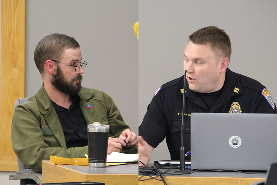 Paulsen and Bartschi have an exchange during the meeting.