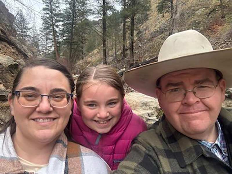 Grace Benson, center, pictured with her parents. | Courtesy U.S. Senate