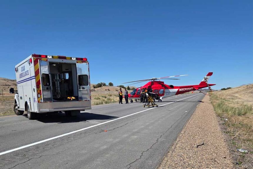 Emergency responders aid a patient who was injured in a three-vehicle crash on Interstate 15 near Levan, Utah, on Friday, June 12, 2026.
