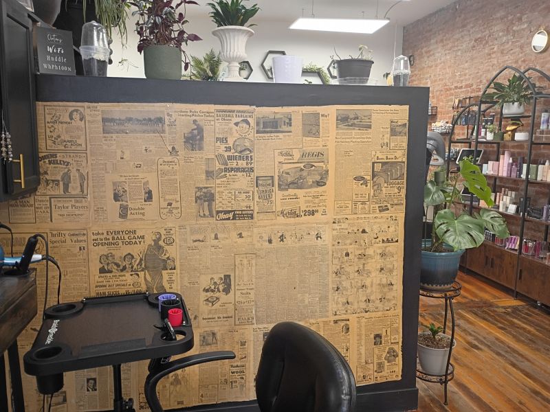Kaylee's newspaper wall