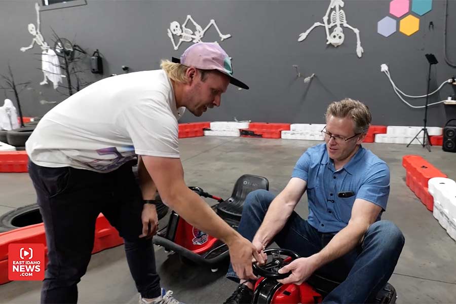 Kyle Ray, left, showing Rett how to steer a crazy kart. | Jordan Wood, EastIdahoNews.com