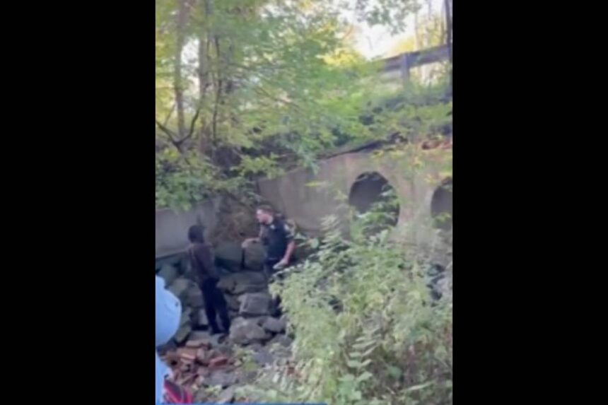 Law enforcement speaks with the individual who is allegedly living in a Maryland sewer.