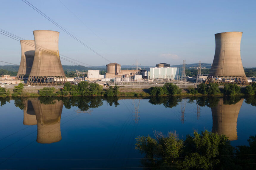 At Constellation's nuclear power plant on Three Mile Island, called the Crane Clean Energy Center, near Middletown, Pennsylvania, the cooling towers are reflected in the Susquehanna River, June 25, 2025. | Ted Shaffrey, Associated Press