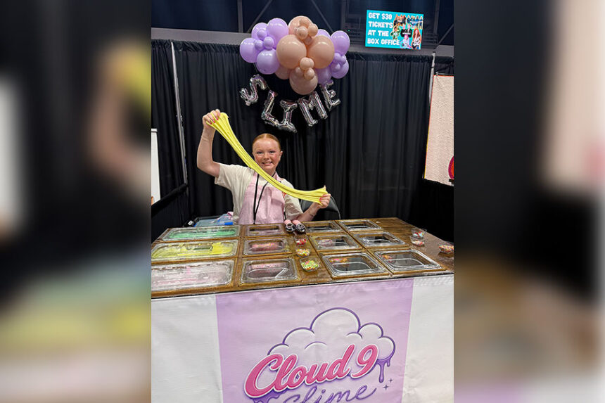 Peyton holds slime at an event.