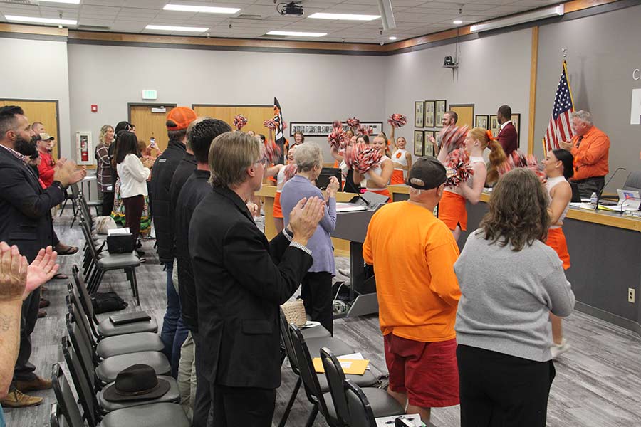 The Bengal Cheer Team leads the crowd in a cheer after the signing.