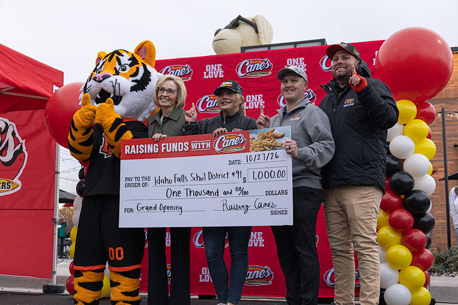 Idaho Falls School District 91 was given a $1,000 check during the grand opening of Raising Cane's new location in Idaho Falls. | Daniel V. Ramirez, EastIdahoNews.com