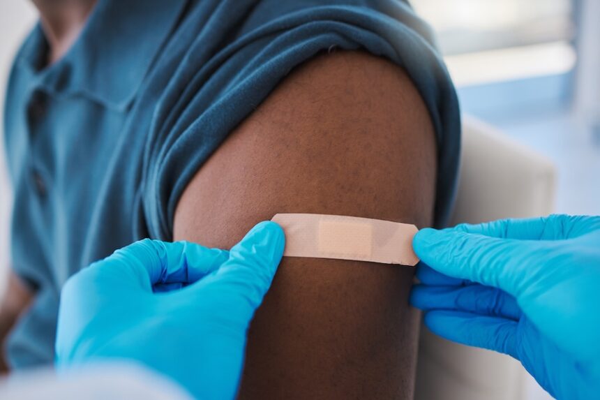 applying bandage after vaccination in medical sett 2026 09 24 12 42 05 utc