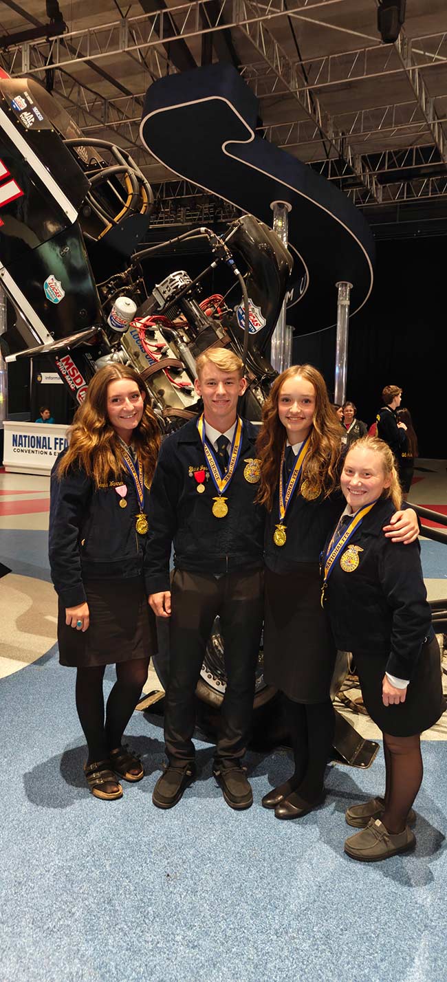 Rigby junior Blake Jossi, second from left, with his sister, Emily, right, and the rest of his team in Indiana. | Courtesy Lex Godfrey