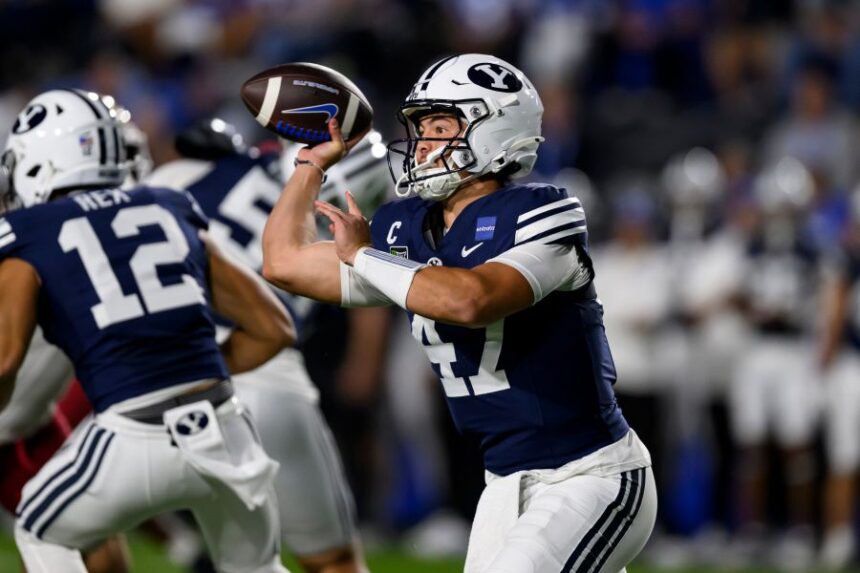 BYU quarterback Bear Bachmeier (47) looks to pass the ball during the first half of an NCAA college football game against Iowa State, Friday, Oct. 9, 2026, in Provo, Utah. (AP Photo/Tyler Tate)