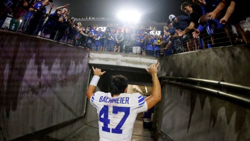 FORT WORTH, TEXAS - OCTOBER 3: Bear Bachmeier #47 of the BYU Cougars celebrates with fans following the team's win over the TCU Horned Frogs at Amon G. Carter Stadium on October 3, 2026 in Fort Worth, Texas. (Photo by Ron Jenkins/Getty Images)