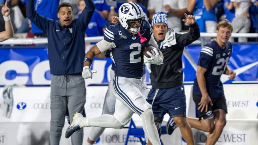 BYU tight end Roger Saleapaga II (2) runs down field after making a juggling catch as BYU and Iowa State play at LaVell Edwards Stadium in Provo on Friday, Oct. 9, 2026.