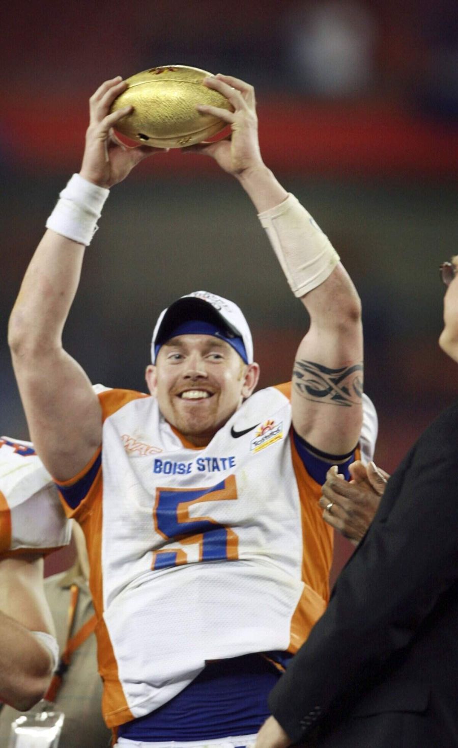 Former Boise State quarterback Jared Zabransky lifts a part of the Fiesta Bowl trophy following his final game as a Bronco in 2007. Idaho Statesman archive