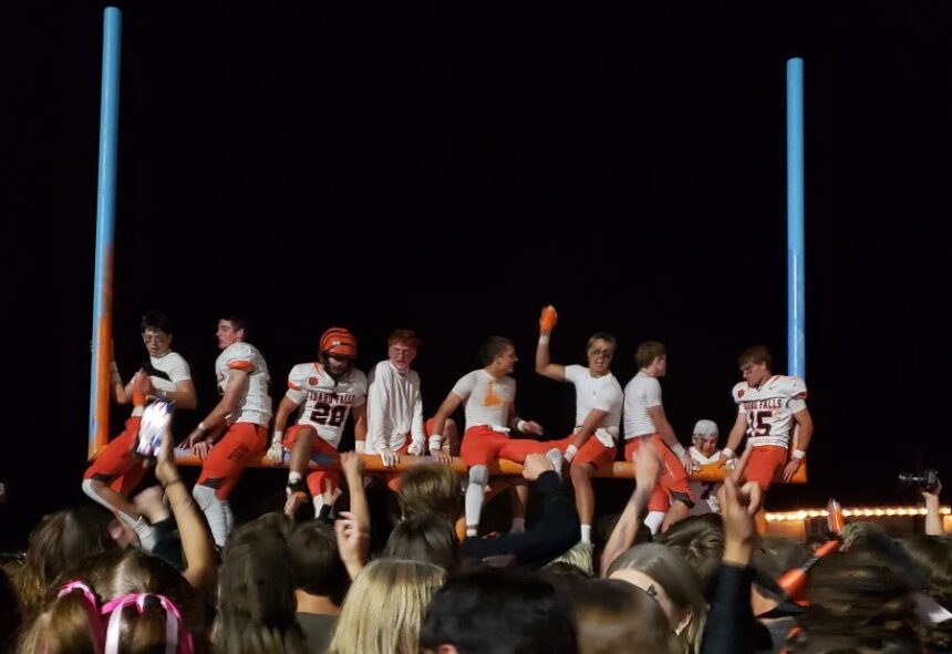 Idaho Falls players celebrate their Emotion Bowl win by painting the goal post at Ravsten Stadium. | Allan Steele, EastIdahoSports.com.