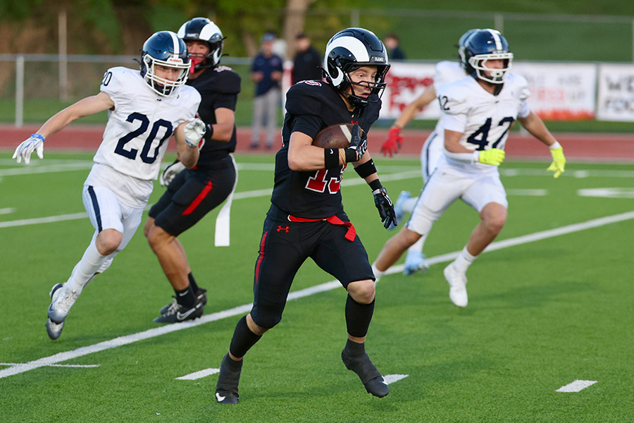 Highland Kellan Tingey returns the opening kickoff 90 yards for a touchdown