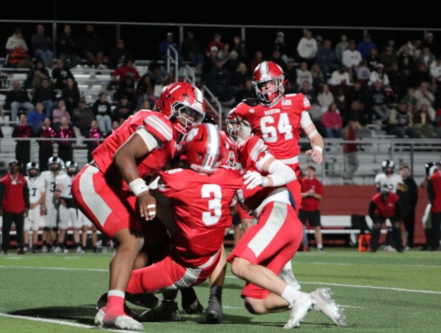 The Madison defense shuts down a Highland ball carrier. | Allan Steele, EastIdahoSports.com