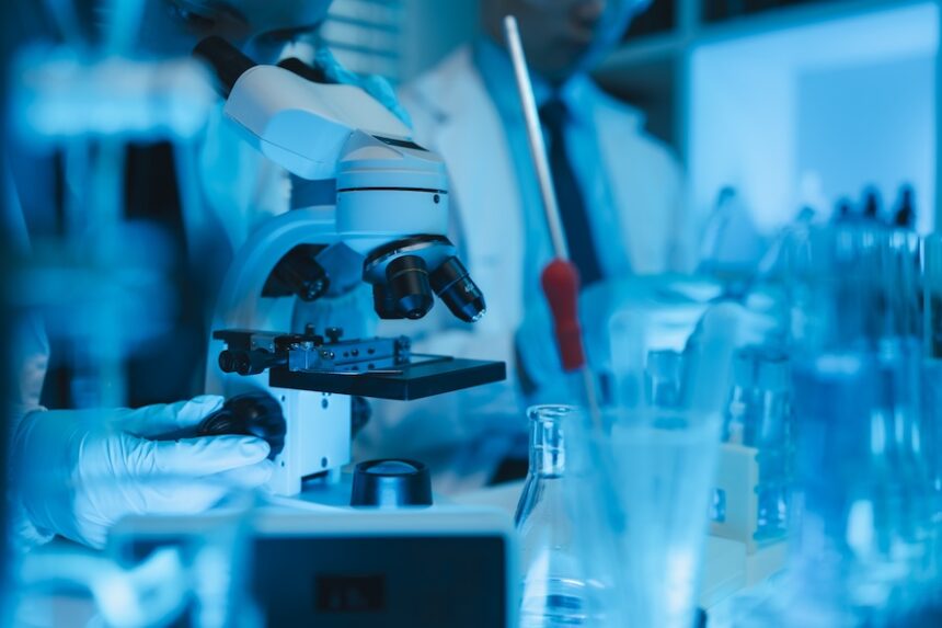 microscope in lab with researcher wearing gloves 2026 09 23 02 55 46 utc
