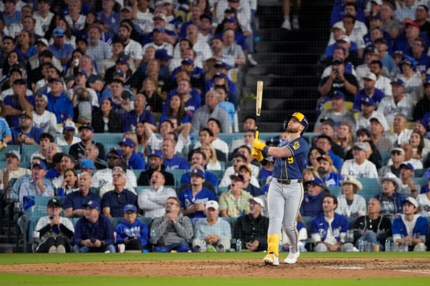 Milwaukee Brewers first baseman Jake Bauers watches his two RBI home run leave the park during the seventh inning of Game 3 of baseball's National League Championship Series between the Milwaukee Brewers and the Los Angeles Dodgers, Wednesday, Oct. 14, 2026, in Los Angeles. (AP Photo/Mark J. Terrill)