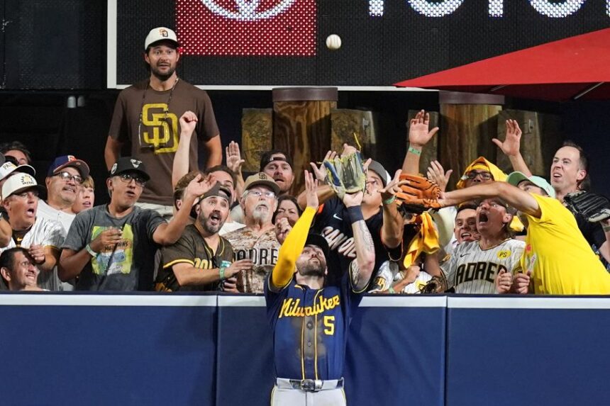 Milwaukee Brewers center fielder Garrett Mitchell catches a ball hit by San Diego Padres' Manny Machado during the eighth inning in Game 4 of baseball's National League Division Series Wednesday, Oct. 7, 2026, in San Diego. (AP Photo/Gregory Bull)