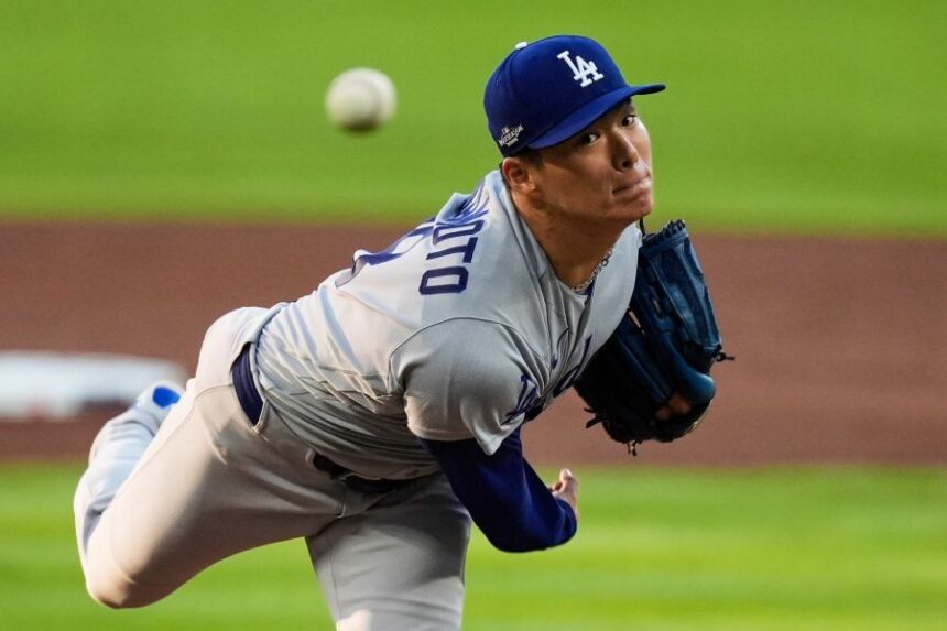 Los Angeles Dodgers pitcher Yoshinobu Yamamoto throws to the Atlanta Braves during the first inning in Game 3 of baseball's National League Division Series, Tuesday, Oct. 6, 2026, in Atlanta. (AP Photo/Mike Stewart)