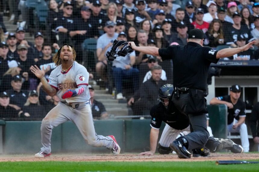 Cleveland Guardians' José Ramírez, left, celebrates after scoring on a fielder's choice by Chase DeLauter during the fifth inning in Game 3 of baseball's American League Division Series against the Chicago White Sox Wednesday, Oct. 7, 2026, in Chicago. (AP Photo/Nam Y. Huh)