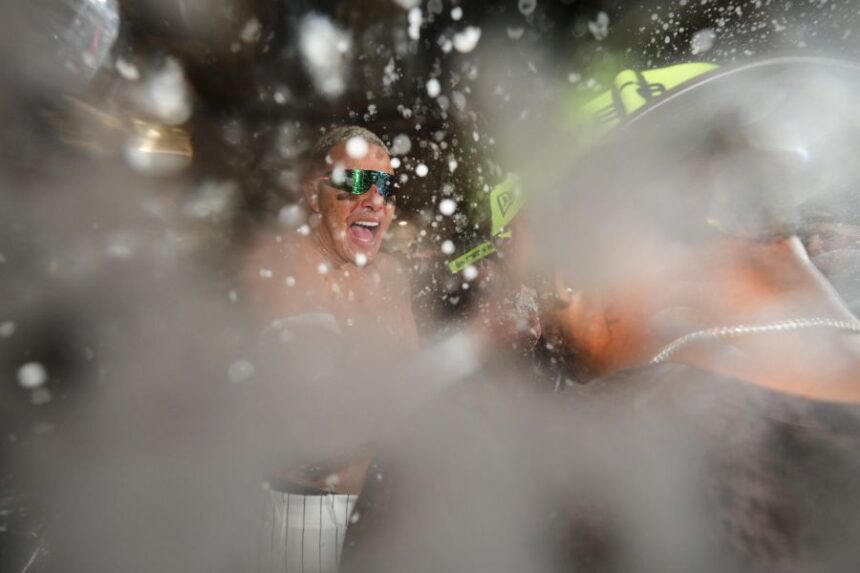 San Diego Padres third baseman Manny Machado celebrates with teammates after defeating the Chicago Cubs in Game 2 of the National League Wild Card baseball playoff series Wednesday, Sept. 30, 2026, in San Diego. (AP Photo/Gregory Bull)