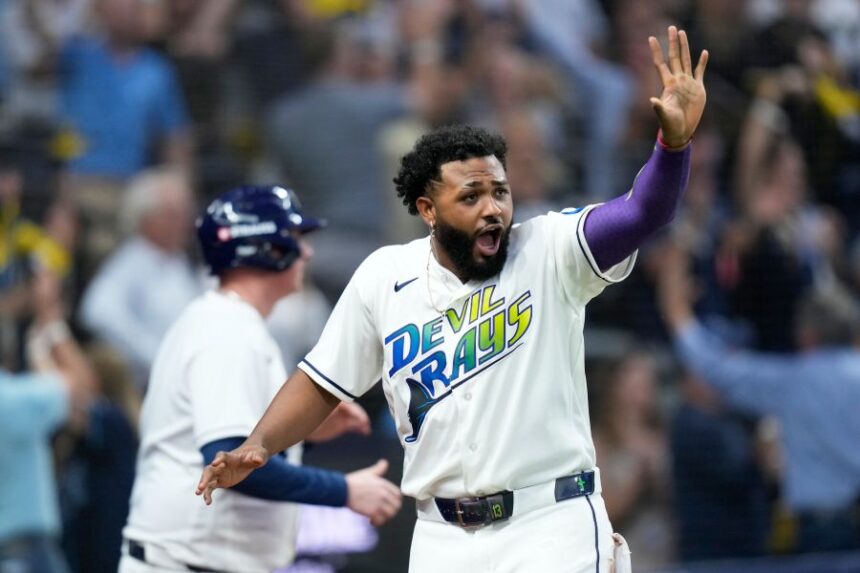 Tampa Bay Rays' Junior Caminero celebrates after scoring against the Cleveland Guardians during the fourth inning in Game 2 of an American League Championship Series baseball game in St. Petersburg, Fla. Tuesday, Oct. 13, 2026. (AP Photo/David J. Phillip)