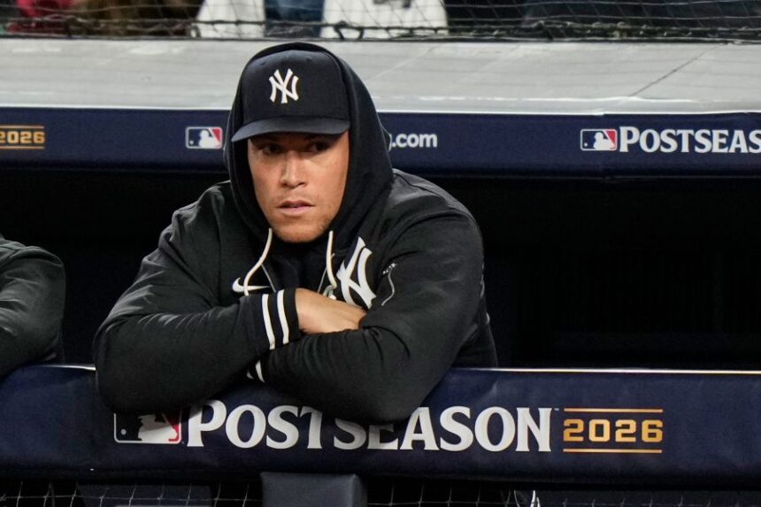 New York Yankees' Aaron Judge stands in the dugout watching play against the Tampa Bay Rays during the second inning in Game 3 of baseball's American League Division Series, Wednesday, Oct. 7, 2026, in New York. (AP Photo/Seth Wenig)
