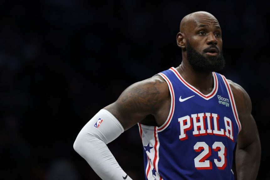 Philadelphia 76ers' LeBron James looks on during the first half of a preseason NBA basketball game against the Brooklyn Nets, Thursday, Oct. 8, 2026, in New York. (AP Photo/Pamela Smith)