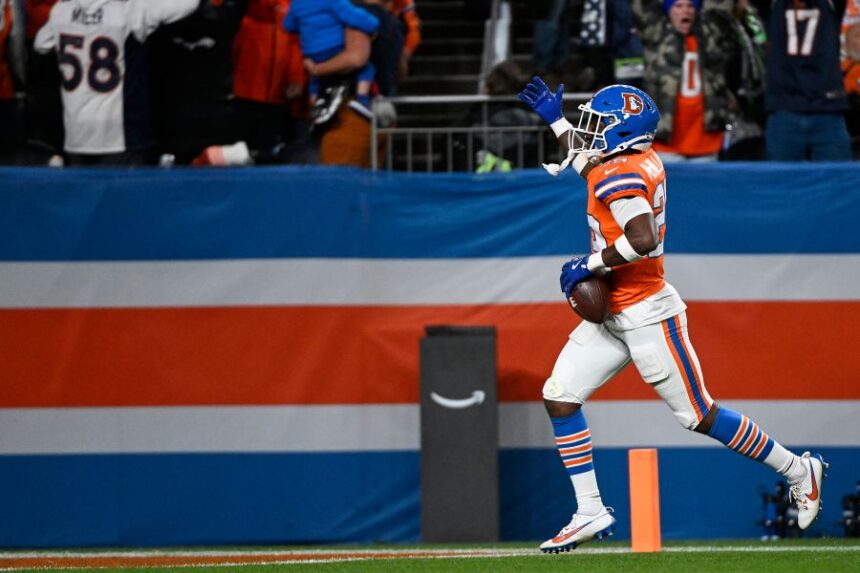 Denver Broncos cornerback Ja'Quan McMillian celebrates an interception against the Seattle Seahawks during overtime in an NFL football game in Denver, Thursday, Oct. 15, 2026. (AP Photo/Geneva Heffernan)