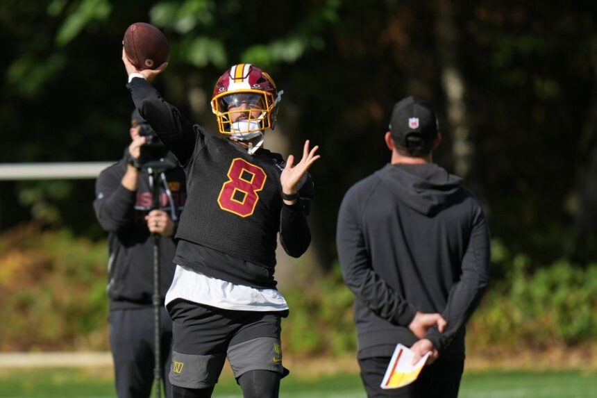 Washington Commanders' quarterback Marcus Mariota throws the ball during an NFL football practice in Hertfordshire, England, Friday, Oct. 2, 2026. (AP Photo/Alastair Grant)