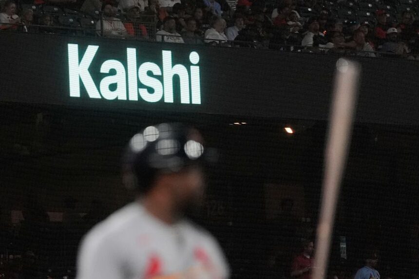 FILE - A Kalshi advertisement is displayed at Oracle Park during a baseball game between the San Francisco Giants and the St. Louis Cardinals, Tuesday, Sept. 8, 2026, in San Francisco. (AP Photo/Jeff Chiu, File)