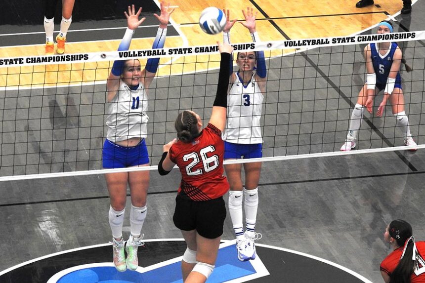 Rockland Mahana Hatch (11) and Brilee Steidley (3) team up to block Mackay Bentley Summers