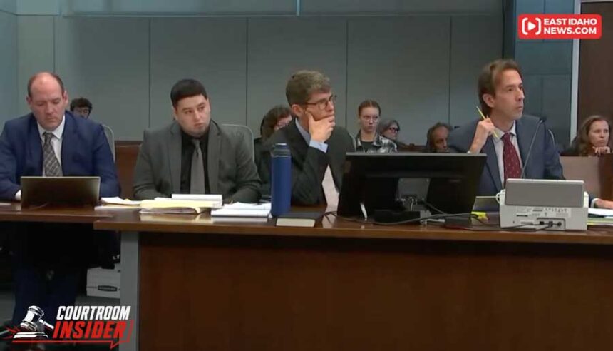 Miguel Salguero-Olivares, second from left, sits among his defense team during his murder trial, Monday, Oct. 12, 2026, at the Durham County Courthouse in Durham, N.C.